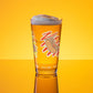 Sip beer from Hot Dog Lover Shaker Pint Glass (16 oz) by Boogs & Boop.