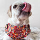 Pug With Tongue Out Wearing Step-In Roses Are Red Print Dog Harness by Boogs & Boop.